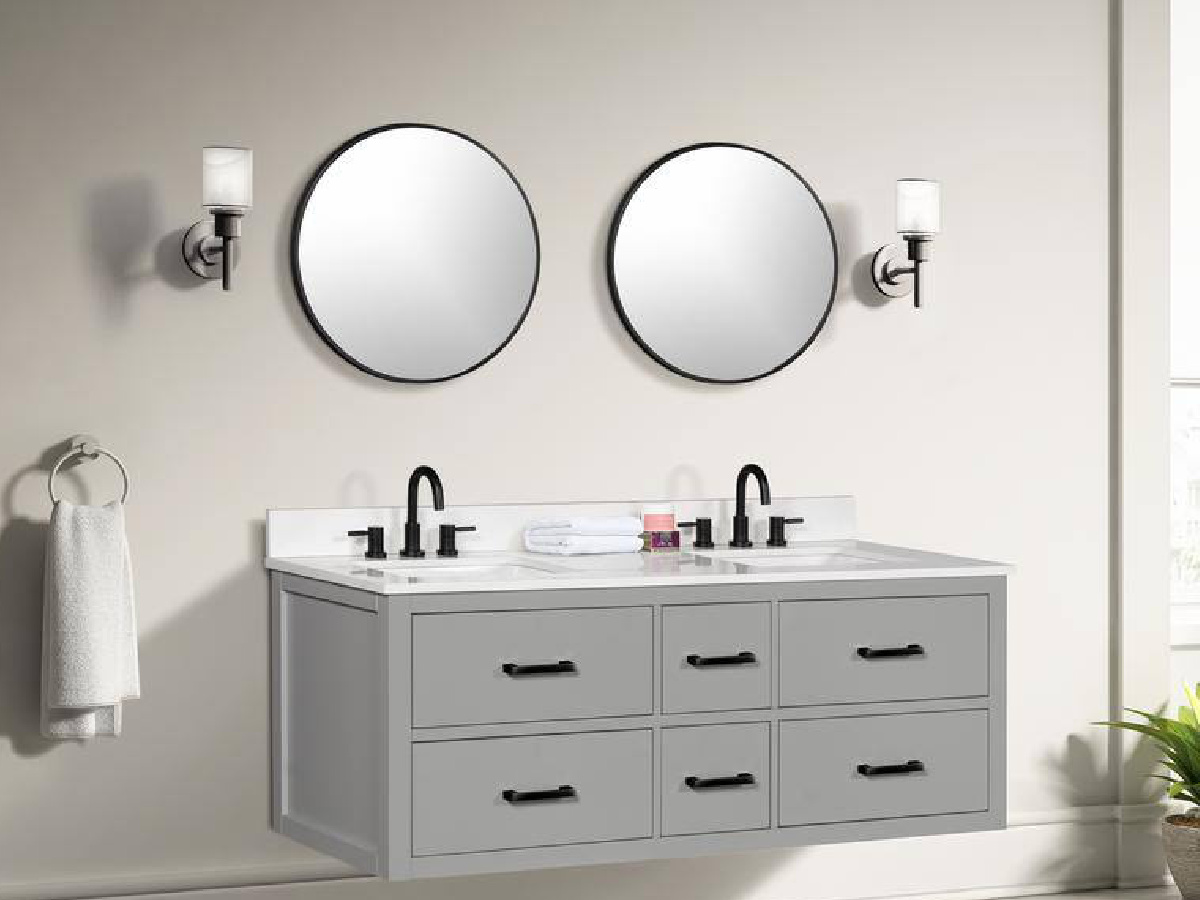 two round Steel Framed Wall Bathroom Vanity Mirrors on top of vanity