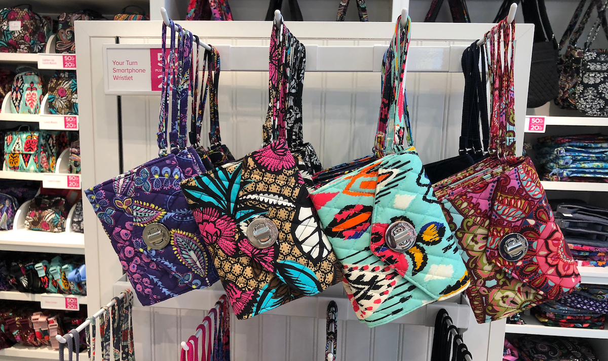 colorful vera bradley printed wristlets hanging from white store shelf