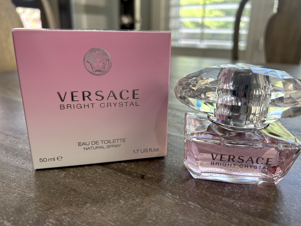 Versace perfume on table
