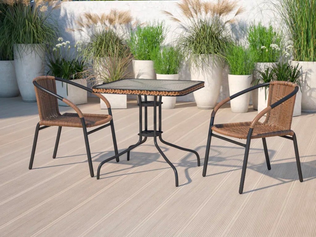 tan and black dining set on patio