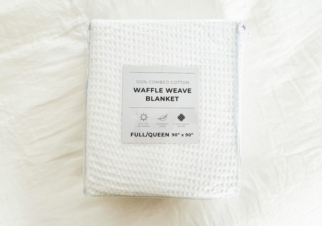 white waffle knit blanket bag on white sheet boll and branch lookalikes