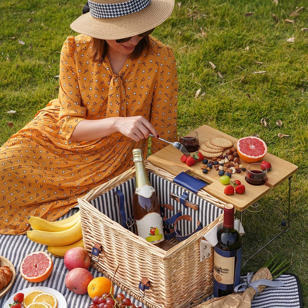 One of the best bridal shower gift ideas is a romantic picnic basket for two like the one this woman is using 