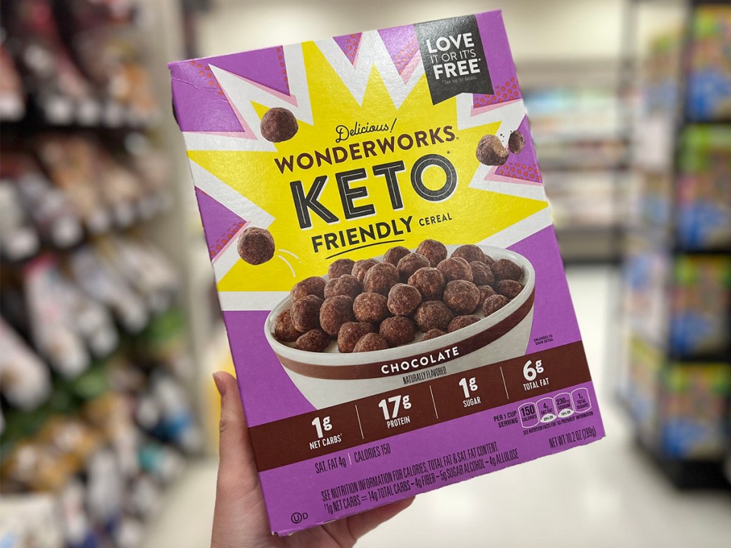 hand holding choclate keto cereal