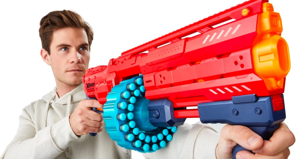 kid holding xshot red blaster toy