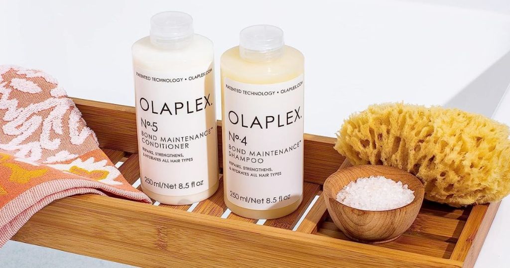 Olaplex No.4 Bond Maintenance Shampoo 8.5 oz & No.5 Conditioner 8.5 oz - COMBO Pack shown in bath with sponge and towel