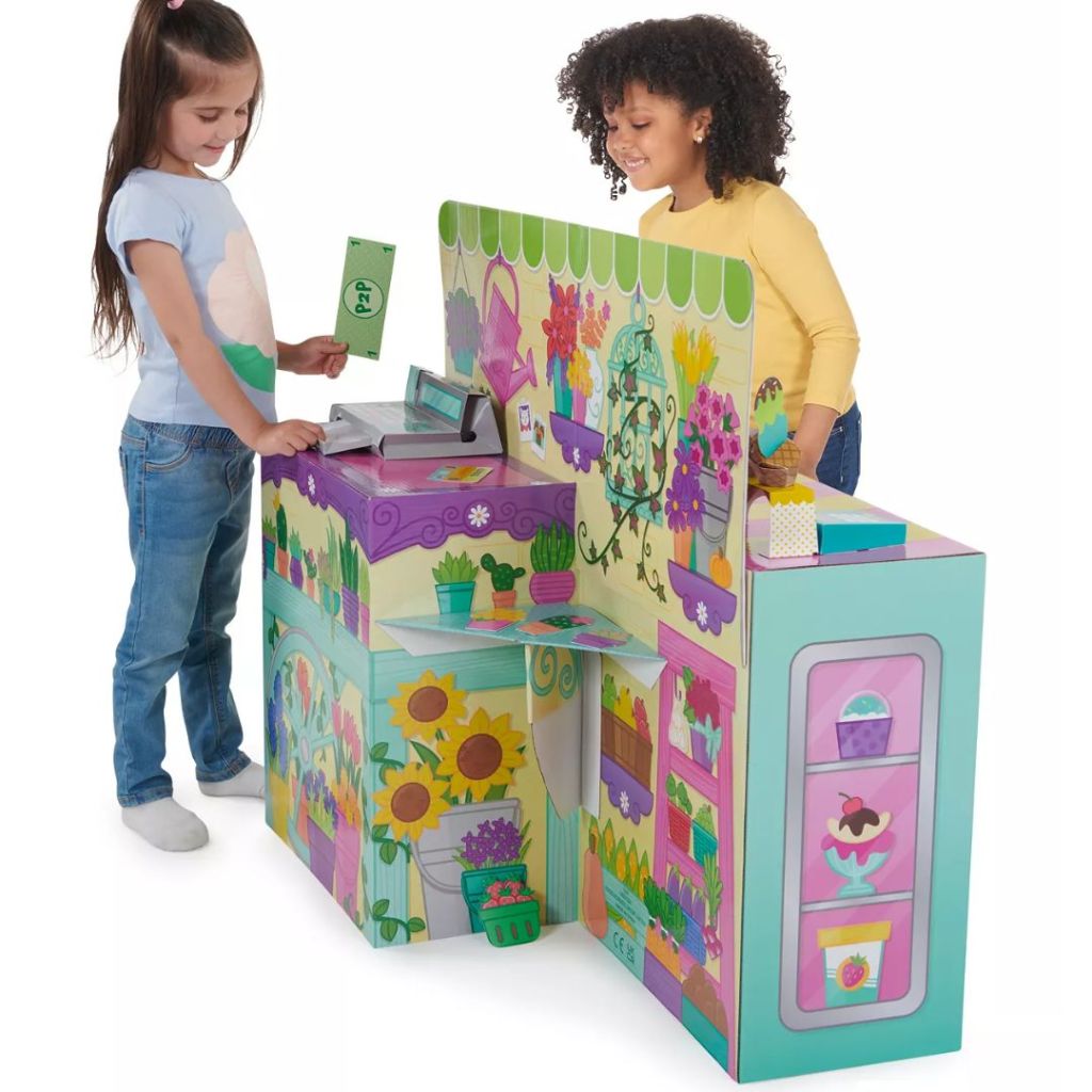 Two little girls playing with a 2-in-1 Flower Market and Ice Cream Shop by WowWee