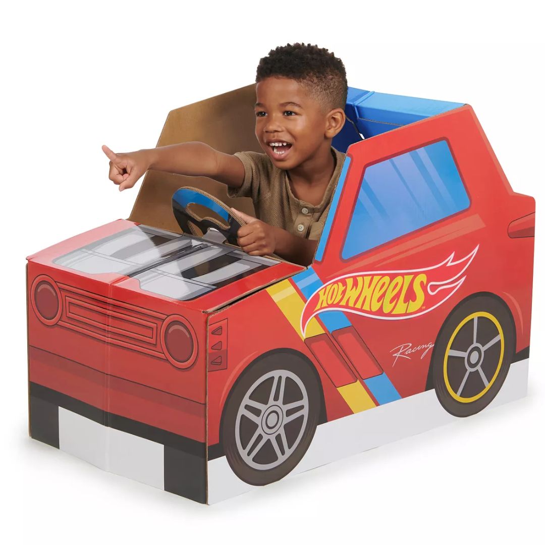 Little boy playing in a Pop2Play Hot Wheels Car