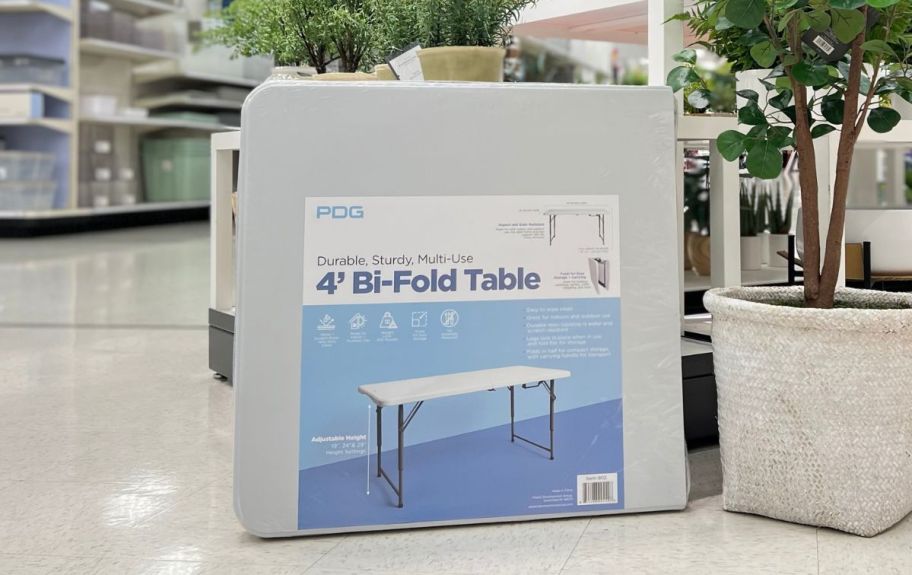 a 4ft bifold table on an aisle in a target store
