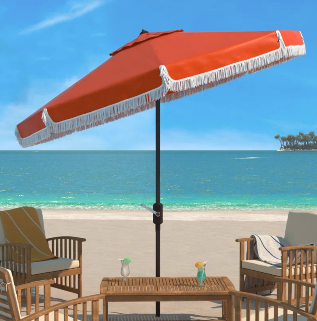A retro style beach umbrella with fringe