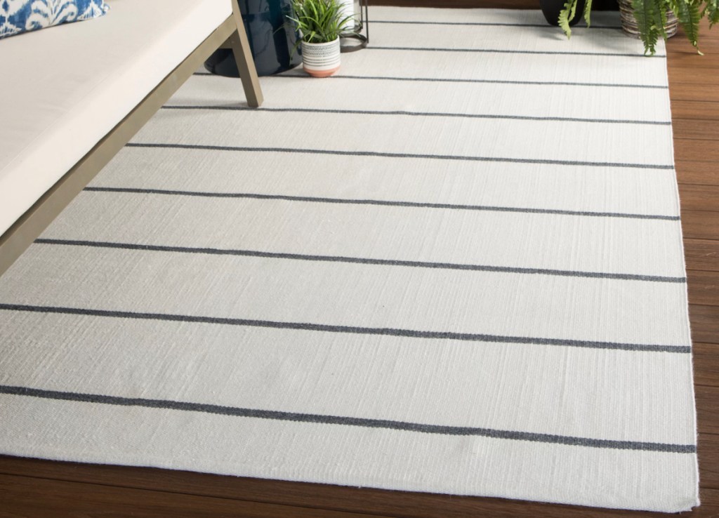 white stripe rug on restoration hardware patio furniture
