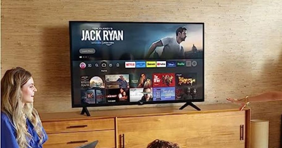 Amazon Fire TV 32" 2-Series HD Smart TV w/ Fire TV Alexa Voice Remote on tv stand in living room