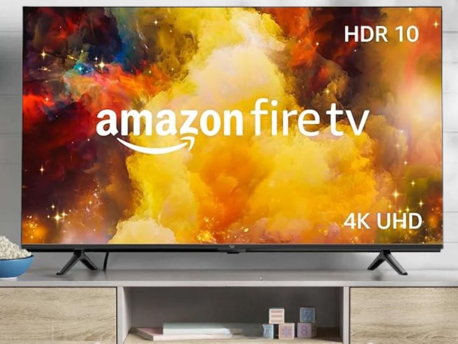 Amazon Fire TV 43" Omni Series 4K UHD Smart TV w/ Alexa on tv stand