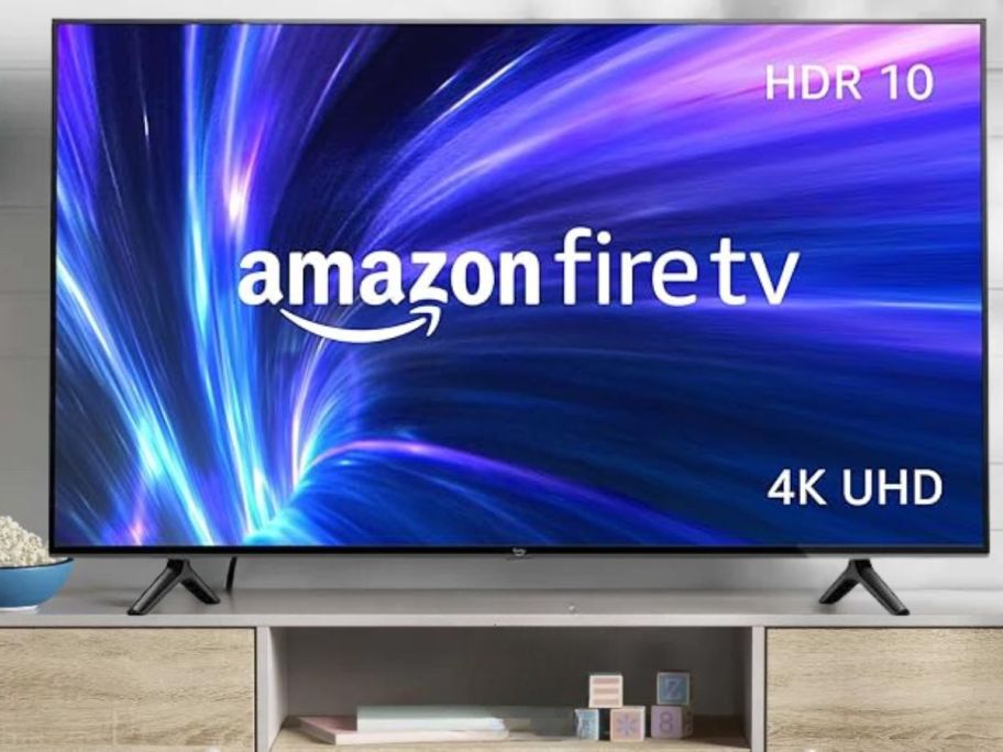 Amazon Fire TV 55" 4-Series 4K UHD Smart TV w/ Fire TV Alexa Voice Remote on tv stand