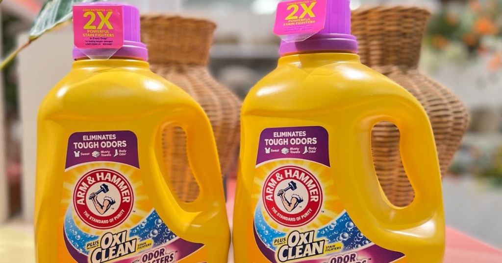 Two bottles of Arm & Hammer laundry detergent