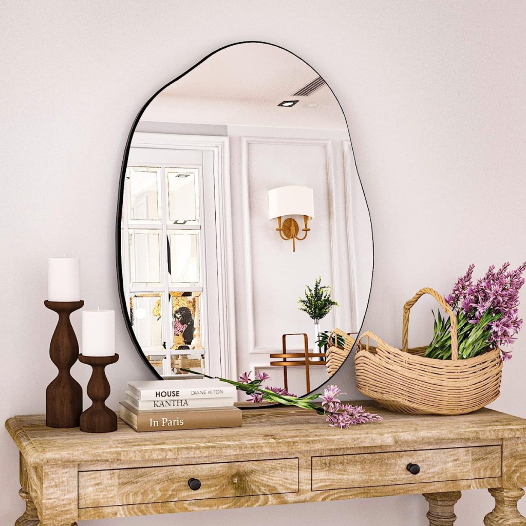 Irregular mirror placed above a hall table