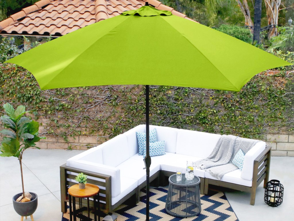 green patio umbrella over outdoor couch