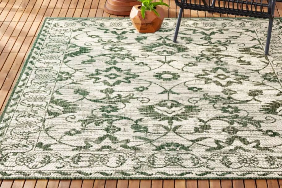 white and green outdoor patio rug