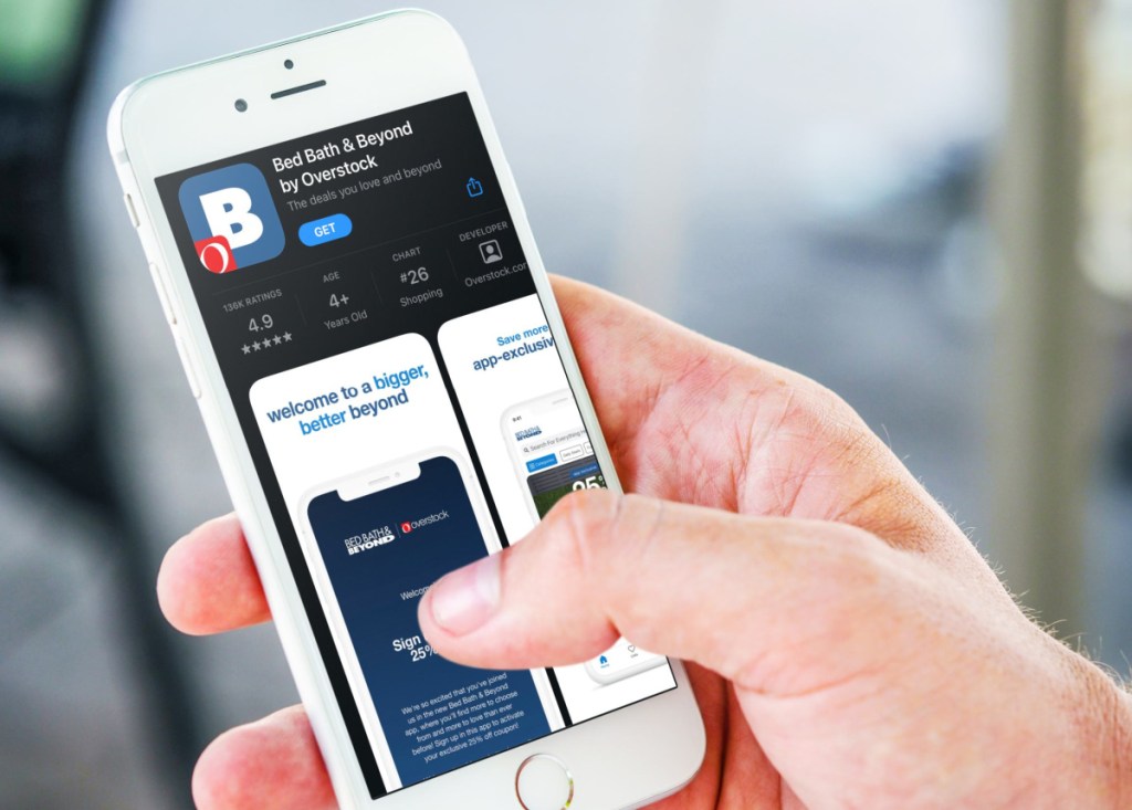 Man browsing the new Bed Bath and Beyond by Overstock app on his phone