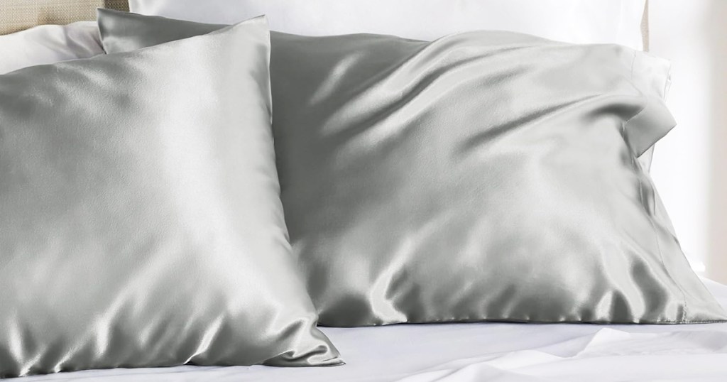grey satin pillowcases on bed