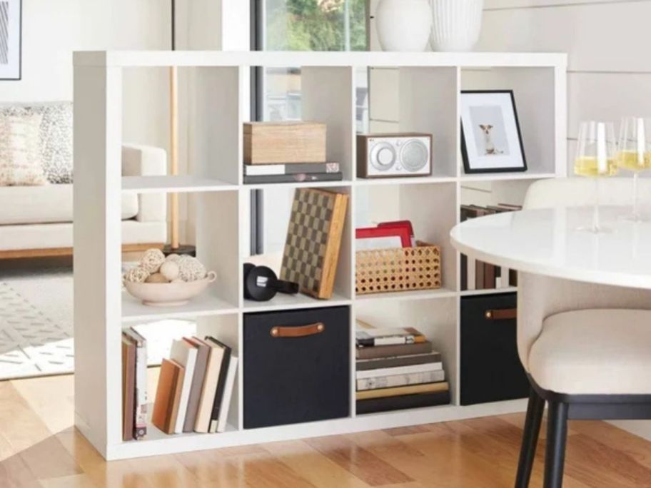 A cube storage organizer in white in an entryway