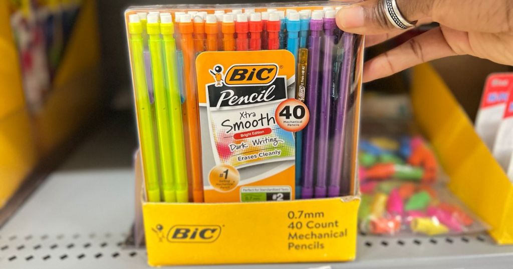 hand holding a large pack of colorful BIC mechanical pencils on store shelf