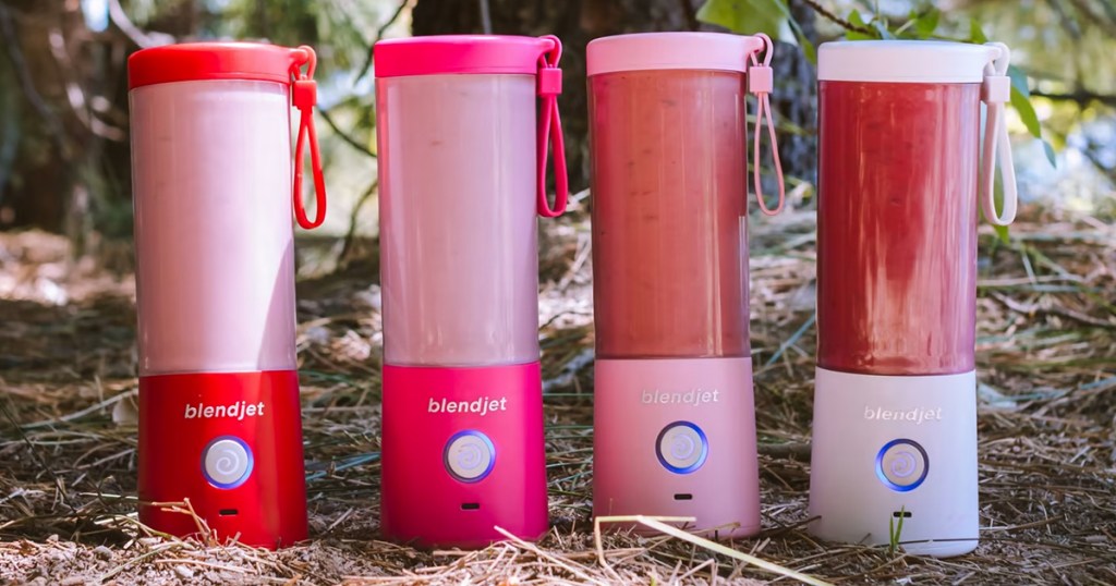 red, pink, and white blendjet blenders outdoors