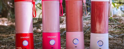 red, pink, and white blendjet blenders outdoors
