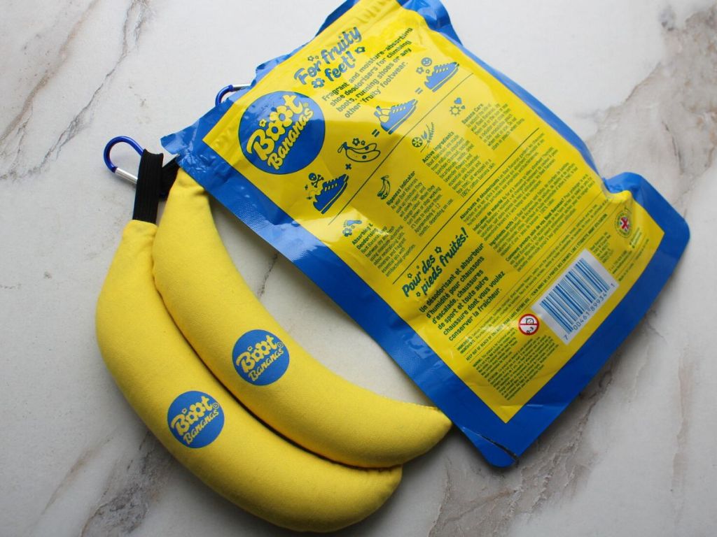a pair of Boot Bananas next to the package with the back of the packaging displayed