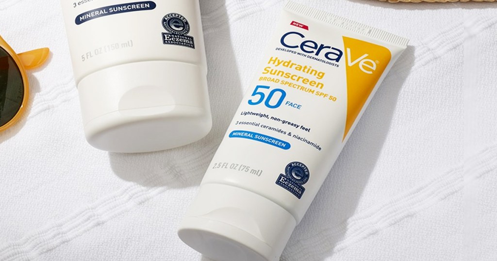 bottles of cerave sunscreen on white towel