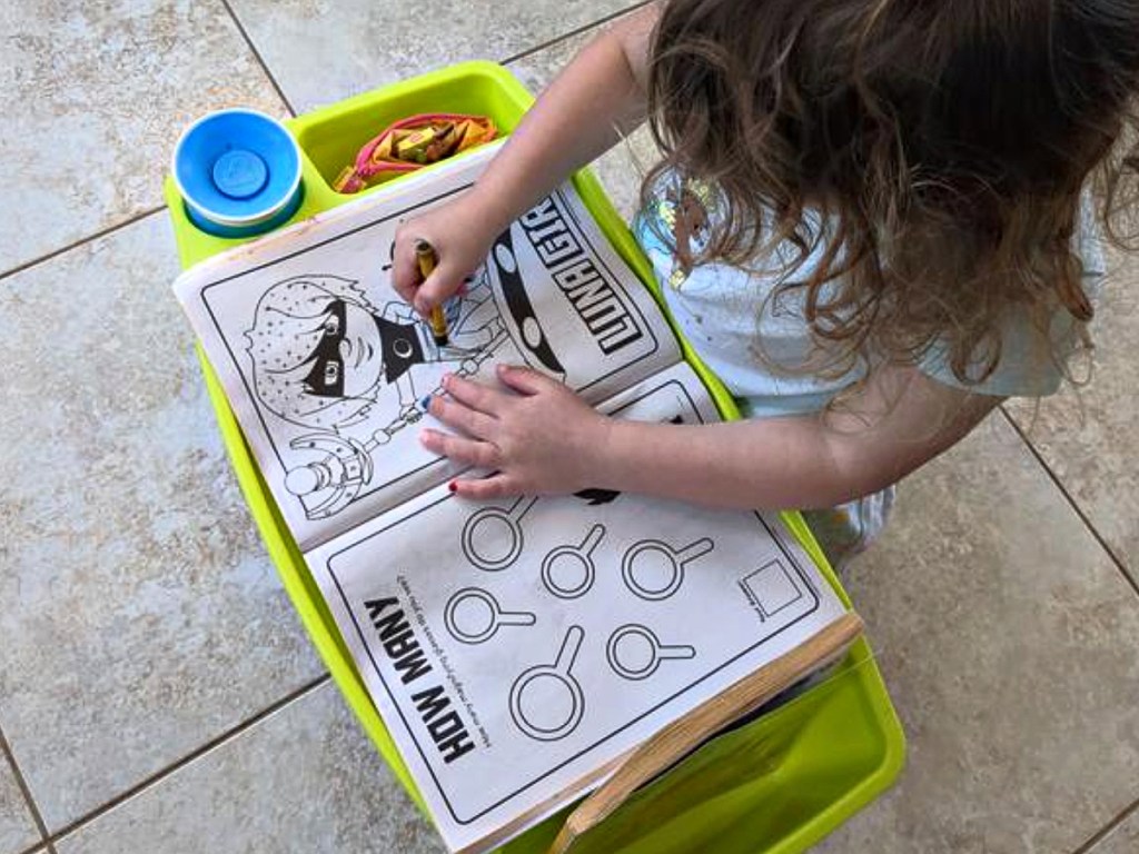 little girl coloring on Creatology Green Lap Tray