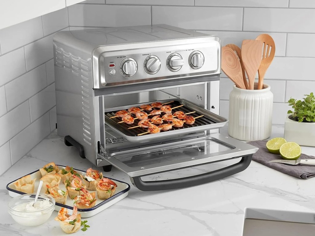 Cuisinart Air Fryer Toaster Oven with food in it and around it