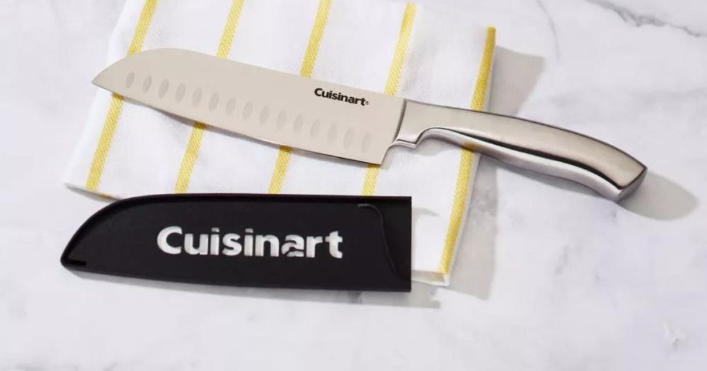 Cuisinart Knife with Sheath laying on a kitchen towel