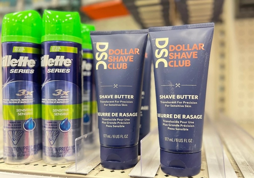 Two tubes of Dollar Shave Club Shave Butter on a shelf at a store