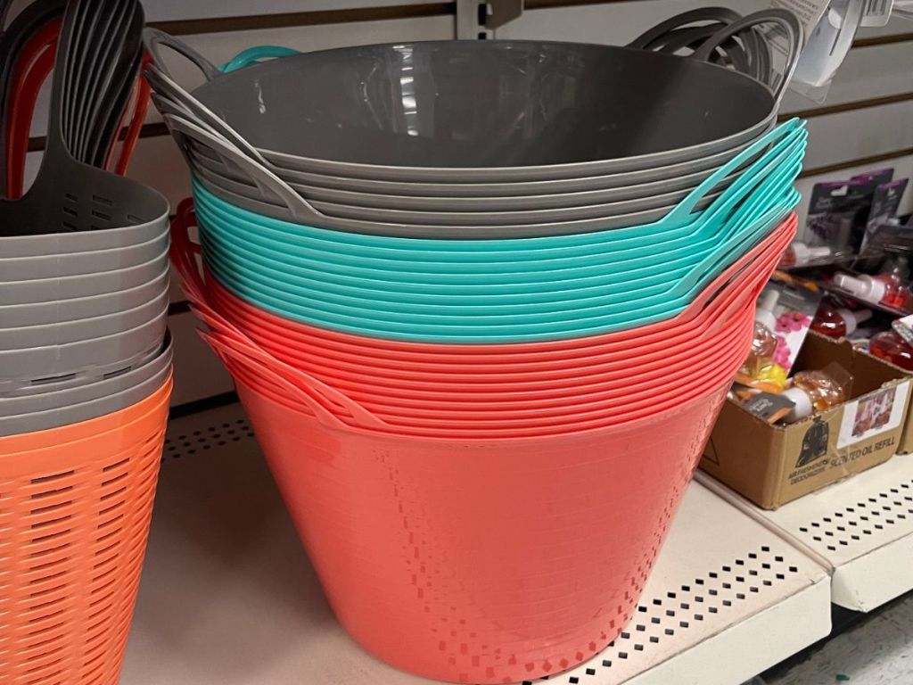 a stack of plastic storage bins on the shelf at Dollar Tree