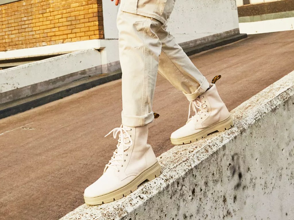 man wearing white dr martens boots
