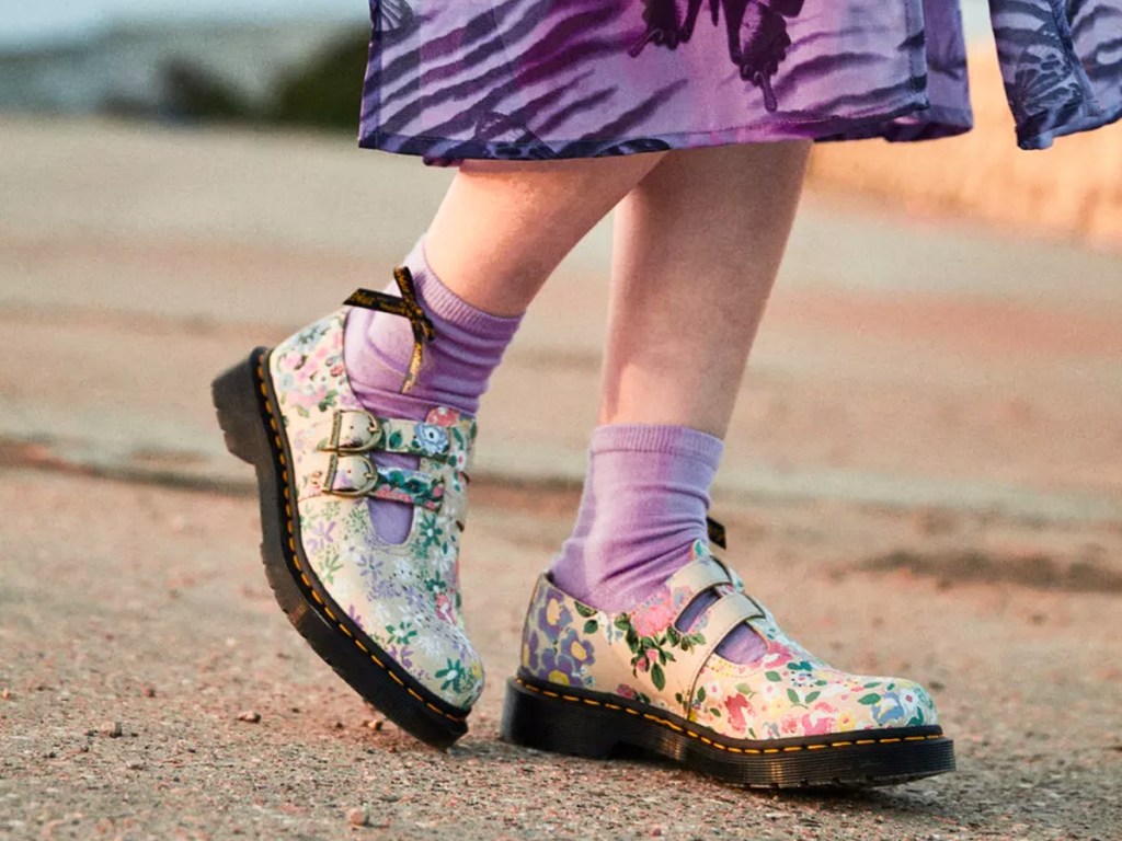 woman wearing floral print mary jane shoes