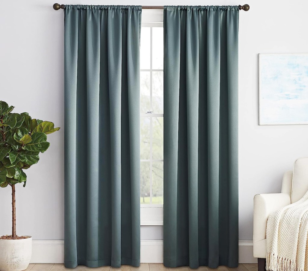 blue grey curtain panels in front of window