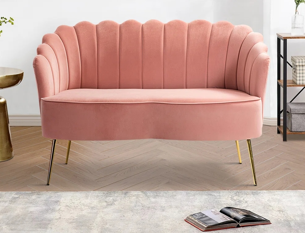 Light pink couch with gold metal legs