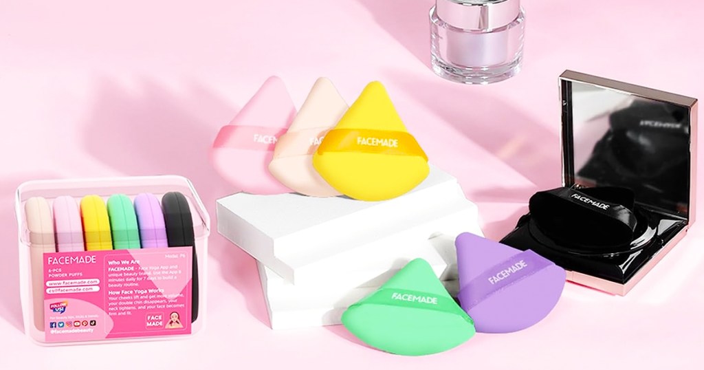 triangle shaped beauty sponges in various colors on pink background