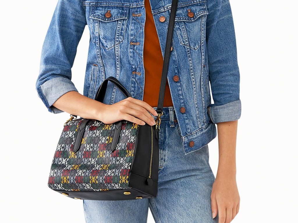 woman with black and multicolor print fossil satchel