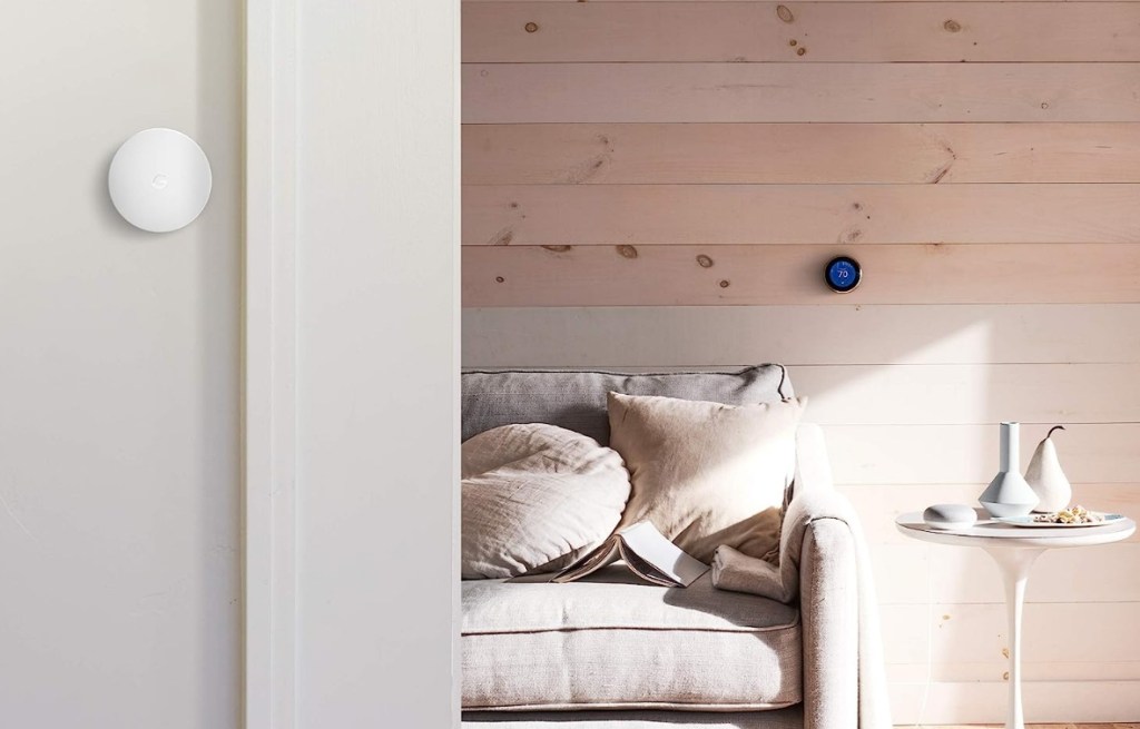 Google Sensor on a wall and a bedroom with a nest thermostast on the wall