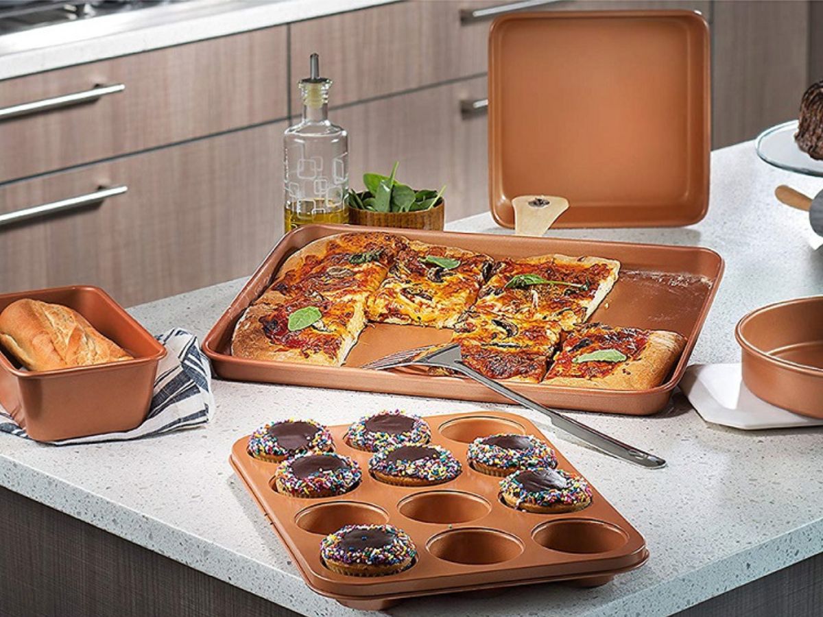 copper baking pans with food in them on countertop