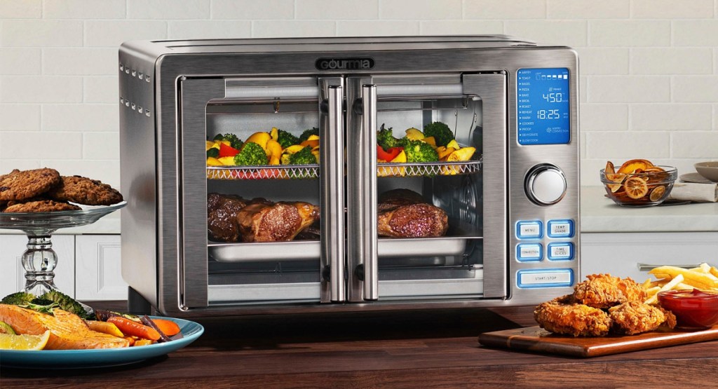 Gourmia Digital Stainless Steel Toaster Oven Air Fryer surrounded by food