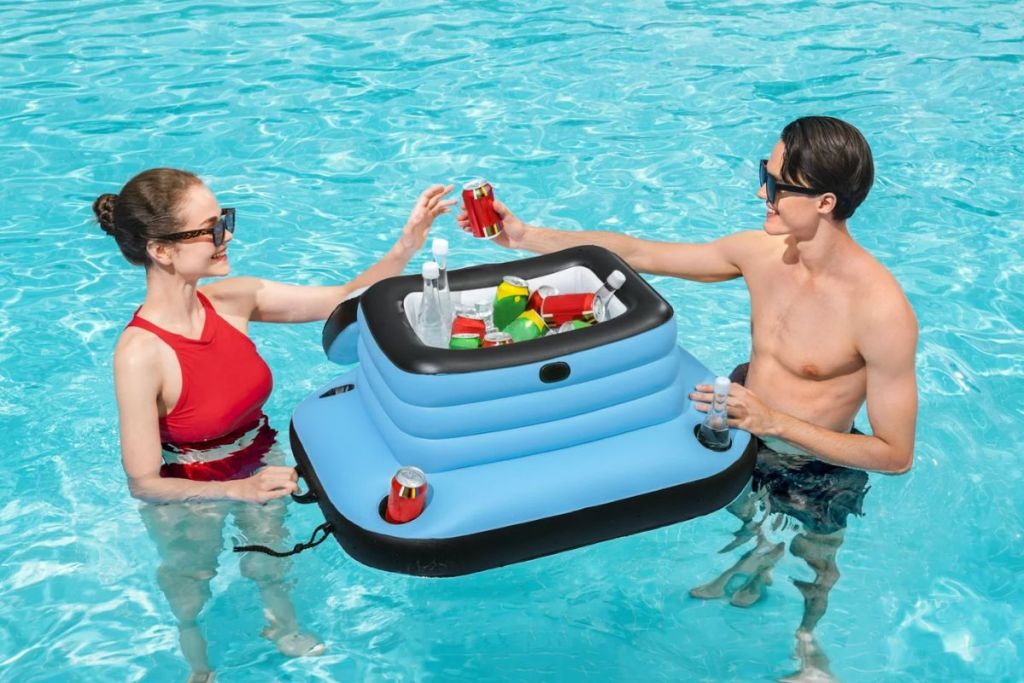 Woman and Man grabbing drinks from an H2OGO Floating Inflatable Cooler in a swimming pool