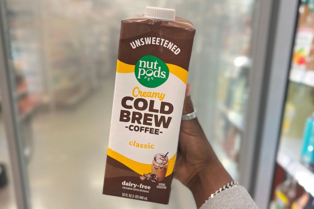 Nutpods Cold Brew Coffee Carton in woman's hand in the aisle at Target