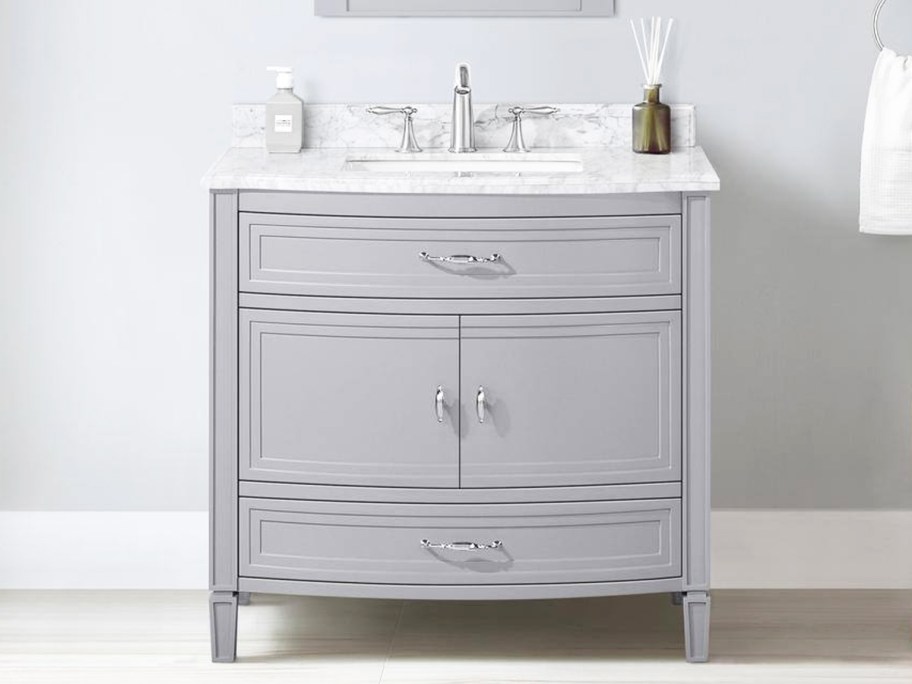grey bathroom vanity with white marble top