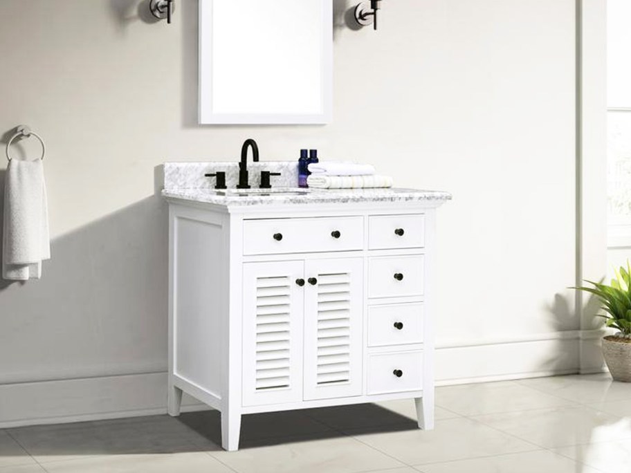 white bathroom vanity with marble top