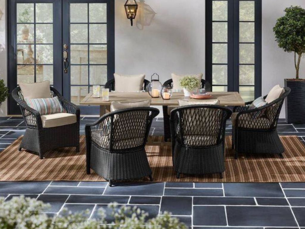 Outdoor wicker dining set on porch