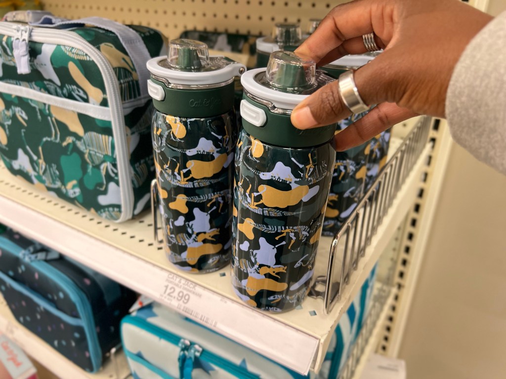 Cat & Jack Stainless Steel Beverage Bottles at Target, Camo Design shown with woman's hand picking it up