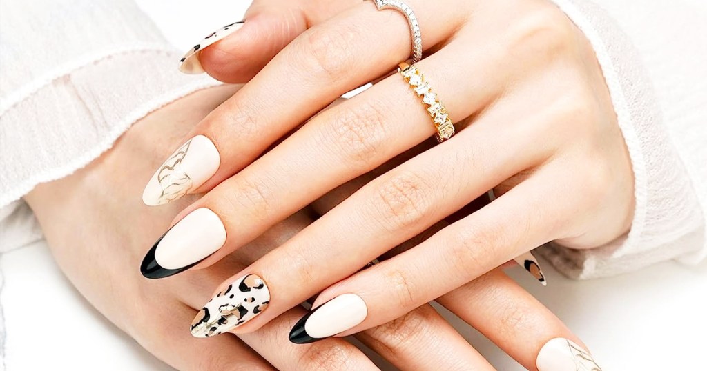 hands with leopard print press-on nails